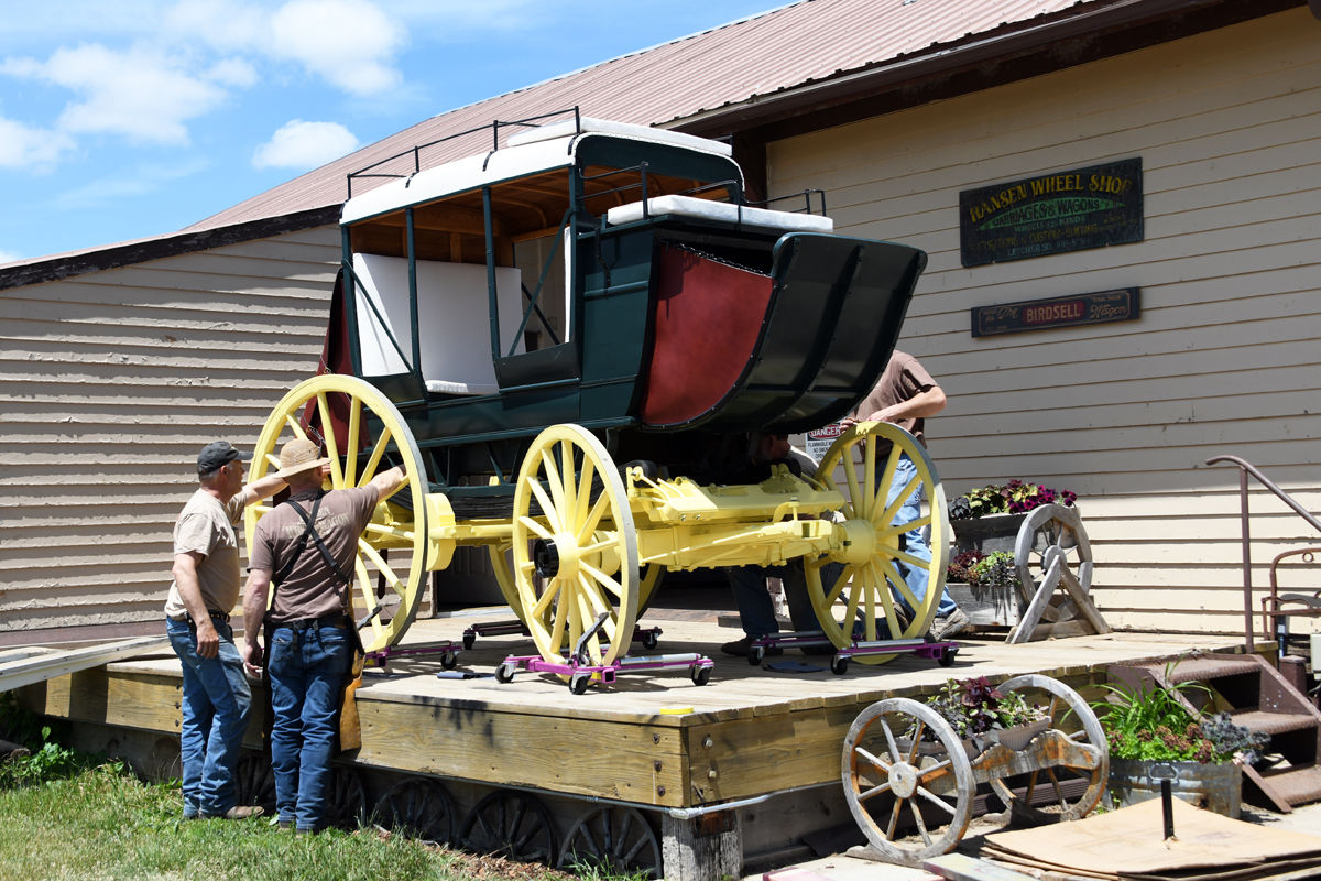 093 Workers putting the finishing touches on a new wagon.JPG